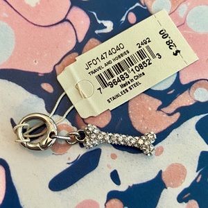 Fossil dog bone charm